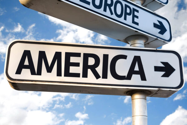 A sign directing a person to go to America.